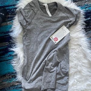 Lululemon women’s grey short sleeved shirt in dry fit material